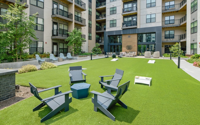 Large courtyard with lounge seating and activity field