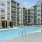 Resort-style swimming pool with lounge seating