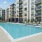 Resort-style swimming pool with lounge seating